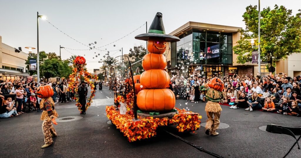 Halloween parade with floats and costumes.